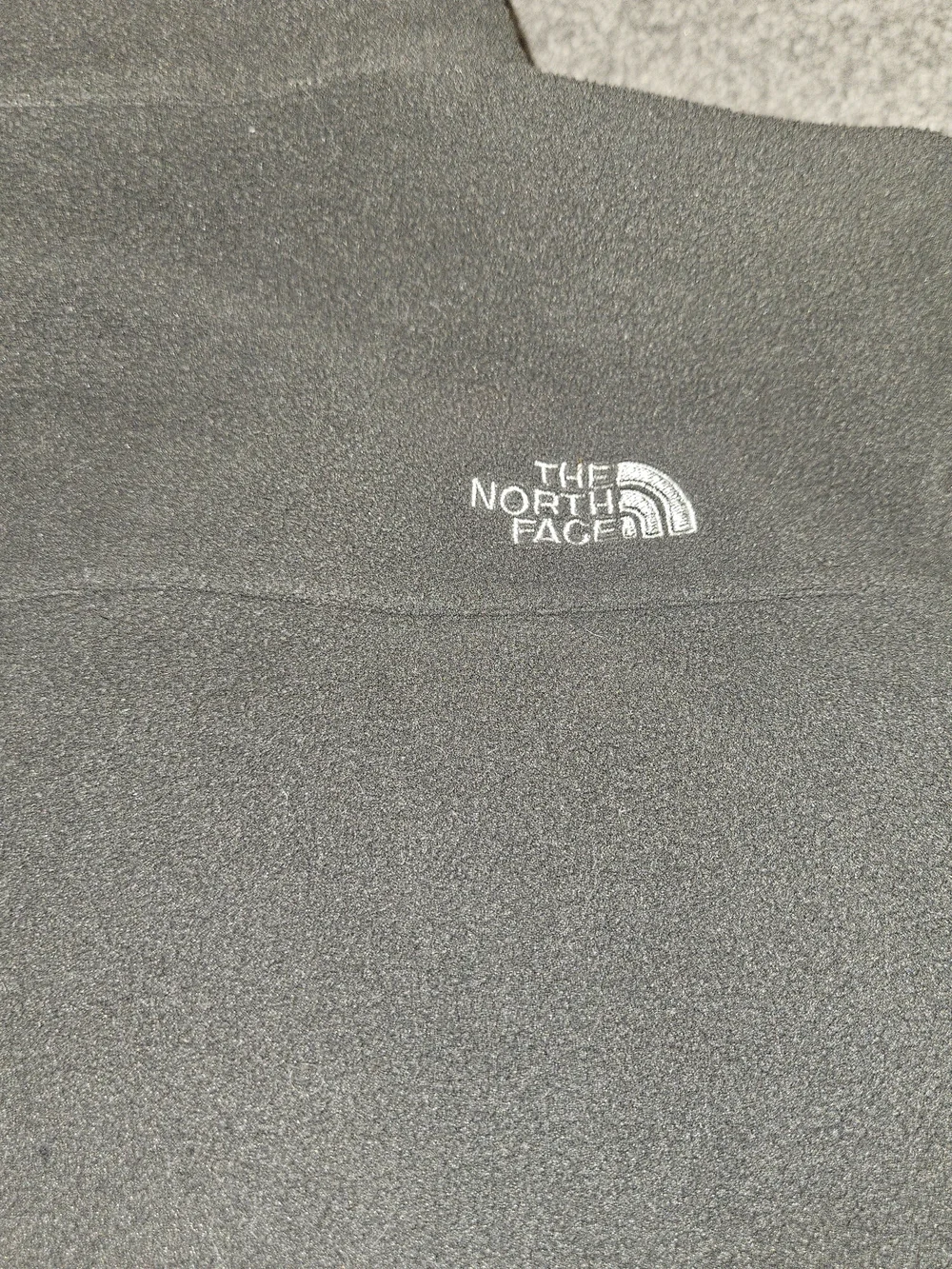 The North Face Kids Dark Gray Fleece Jacket.